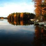 Off the Beaten Path: Maine Destinations This Fall Fall at the lake with boats