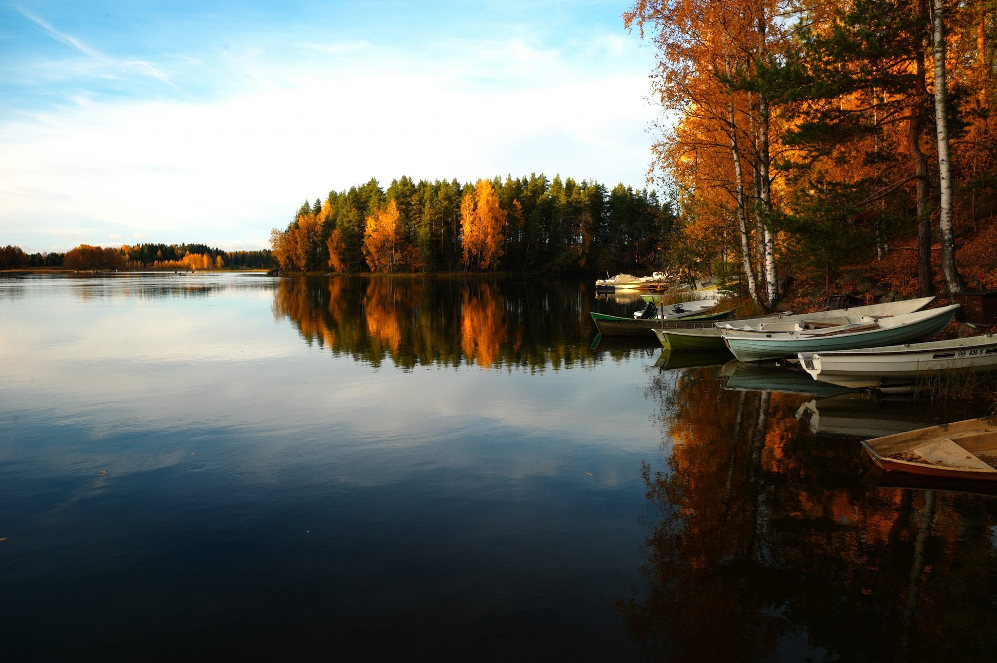 Fall at the lake with boats